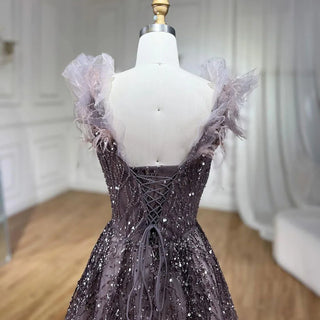 Feathered Fantasy: 2024 Dubai-Inspired Evening Gown with Sexy V-Neck and Beaded Blue Elegance - The Ultimate Choice for Weddings and Grand Soirees.