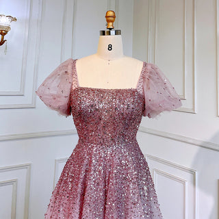 Desert Rose Elegance: Luxury Dubai-Inspired Evening Gown in Rose Pink with Burgundy & Gold Accents - An Arabic Masterpiece for Proms and Wedding Celebrations.
