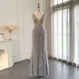 Dubai Champagne Elegance: Luxury Feathered Evening Dress with a V-Neck, Perfect for Women at Weddings and Formal Events, Ideal for Proms with a touch of Silver and Pink.