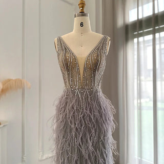 Dubai Champagne Elegance: Luxury Feathered Evening Dress with a V-Neck, Perfect for Women at Weddings and Formal Events, Ideal for Proms with a touch of Silver and Pink.