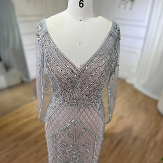 Dubai Glamour: 2024 Nude V-Neck Evening Dress with Crystal Embellishments, Sleeveless Shawl Yarn, and Formal Elegance