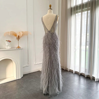 Dubai Champagne Elegance: Luxury Feathered Evening Dress with a V-Neck, Perfect for Women at Weddings and Formal Events, Ideal for Proms with a touch of Silver and Pink.