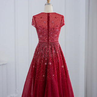 Dubai Elegance: Beaded Silver Evening Dress with Champagne and Burgundy Accents, Tailored for Plus Size Women at Wedding and Formal Parties.