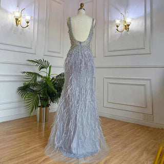 Dubai Pink Plume: Luxury Pink Feathered Evening Dress with Gold Accents and a V-Neck, Perfect for Women at Weddings and Formal Parties.