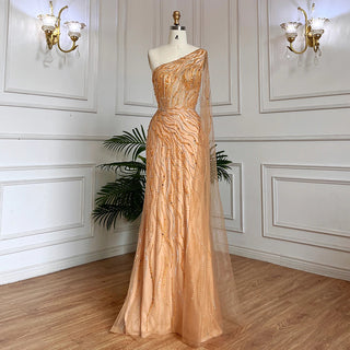 Desert Blossom: One-Shoulder Blush Pink Mermaid Evening Gown with Cape, Accented in Dubai-Inspired Emerald Green - A Luxurious Ensemble for Weddings and Grand Parties.