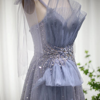 Dubai Dawn: Blush Pink Gown with Elegant Blue Accents and Spaghetti Straps for Wedding Formals.