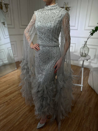 Ships in 1 to 3 Days - 2024 Silver Gray Mermaid Evening Gown with Cape Sleeves, Feathers, and Beaded Detailing - Ankle-Length Formal Dress