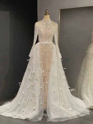 Desert Elegance: Dubai-Inspired White Nude Evening Gown with Overskirt and Feathers - A Beaded Bridal Luxury for Wedding Parties.