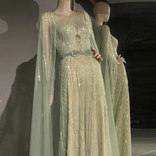 Dubai Mint Elegance 2024: Luxury Beaded Mint Green Evening Dress with Cape, Perfect for Elegant Arabic Women at Long Wedding Parties.
