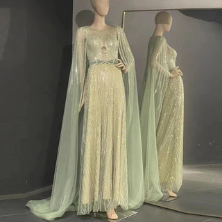 Dubai Mint Elegance 2024: Luxury Beaded Mint Green Evening Dress with Cape, Perfect for Elegant Arabic Women at Long Wedding Parties.