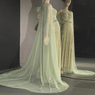 Dubai Mint Elegance 2024: Luxury Beaded Mint Green Evening Dress with Cape, Perfect for Elegant Arabic Women at Long Wedding Parties.