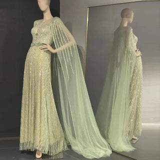 Dubai Mint Elegance 2024: Luxury Beaded Mint Green Evening Dress with Cape, Perfect for Elegant Arabic Women at Long Wedding Parties.