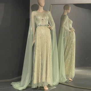 Dubai Mint Elegance 2024: Luxury Beaded Mint Green Evening Dress with Cape, Perfect for Elegant Arabic Women at Long Wedding Parties.