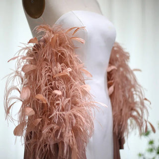 Dubai Petal Elegance: Rose Pink Feathered Gown with Cape for Women's Formal Wedding Festivities.