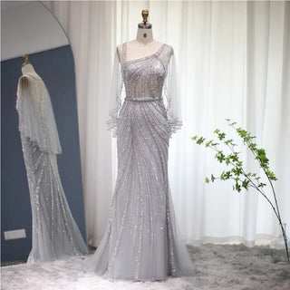 Champagne Elegance: Dubai-Inspired Mermaid Evening Gown with Silver Cape Accent - One-Shoulder Wonder for Proms, Weddings, and Grand Soirees.