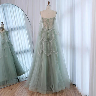 Ships in 2 to 5 Days - Sage Green Luxury Arabic Off-Shoulder Beaded A-Line Evening Dress with Cape Sleeves – 2025 Collection