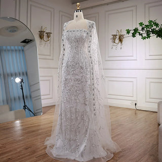 2025 Luxury White Beaded Mermaid Evening Gown with Long Cape – Dubai-Inspired Arabic Formal Dress