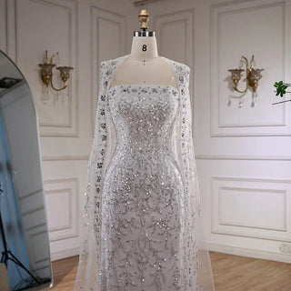 2025 Luxury White Beaded Mermaid Evening Gown with Long Cape – Dubai-Inspired Arabic Formal Dress