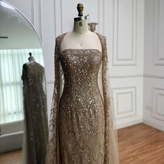 2025 Luxury White Beaded Mermaid Evening Gown with Long Cape – Dubai-Inspired Arabic Formal Dress