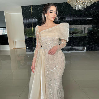 Luxury Nude Crystal Beaded Mermaid Evening Gown with Overskirt & Long Sleeves – Dubai-Inspired Formal Wedding & Prom Dress
