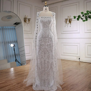 Ships in 2 to 5 Days - 2025 Luxury White Beaded Mermaid Evening Gown with Long Cape – Dubai-Inspired Arabic Formal Dress