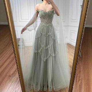 Ships in 2 to 5 Days - Sage Green Luxury Arabic Off-Shoulder Beaded A-Line Evening Dress with Cape Sleeves – 2025 Collection