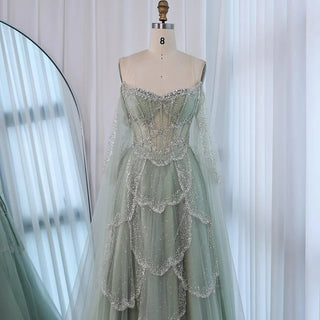 Ships in 2 to 5 Days - Sage Green Luxury Arabic Off-Shoulder Beaded A-Line Evening Dress with Cape Sleeves – 2025 Collection