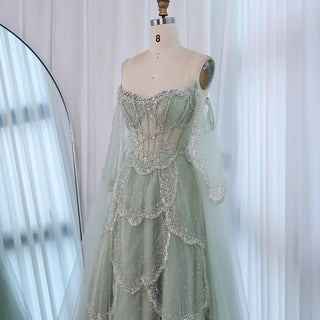 Ships in 2 to 5 Days - Sage Green Luxury Arabic Off-Shoulder Beaded A-Line Evening Dress with Cape Sleeves – 2025 Collection